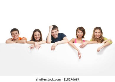 Group Of Teenagers With A Giant, Blank, White Billboard