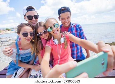  Group Of Teenagers Making Fun Selfie Together