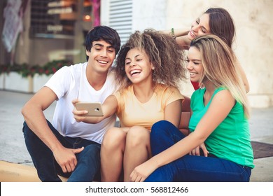 group of teenagers on the street with CellPhones