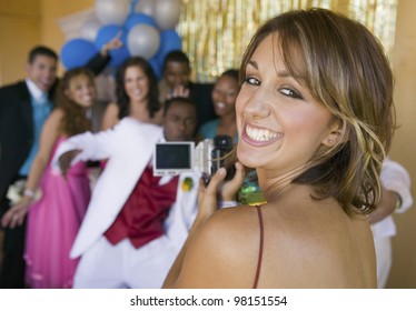 Group Of Teenagers Posing For Photo At Prom