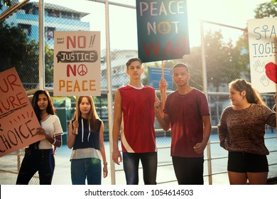 Group Of Teenagers Protesting Demonstration Holding Posters Antiwar Justice Peace Concept