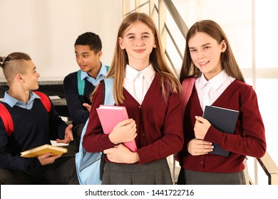 Group Of Teenagers In School Uniform Indoors