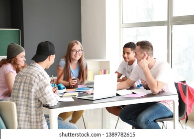 Group Of Teenagers Studying Together In School