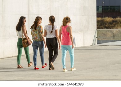 Group Of Teenagers Walking On The Street