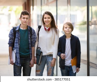 Group Of Teens 15-17 Years Old Going To School With Papers For Study