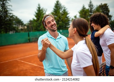 Group of tennis people players giving a handshake after a match - Powered by Shutterstock