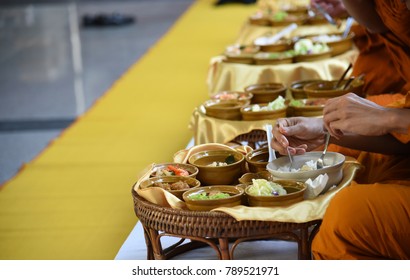 A Group Of Thai Monks Are Having Meal Which The Buddhism Giveaway To Them