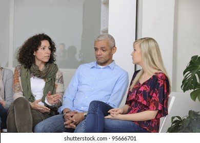 Group Therapy: Diverse People Talking And Giving Support