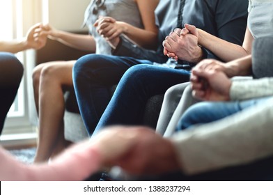 Group therapy, peer support and psychology session. Trust, unity and empathy concept. Empowering community. Hope, help and friendship. Team empowerment. Happy people sitting in circle holding hands.