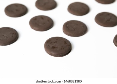 Group Of Thin Mints Cookies On White Background, Chocolate Mint Thin Round Cookies, Top View