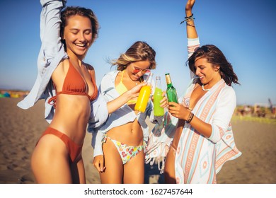 Group of three beautiful attractive young women having fun on the beach. - Shutterstock ID 1627457644