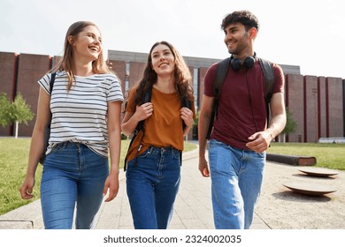 Group of three caucasian students walking through university campus  - Powered by Shutterstock