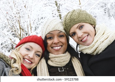 Group Of Three Diverse Young Girl Friends Outdoors In Winter