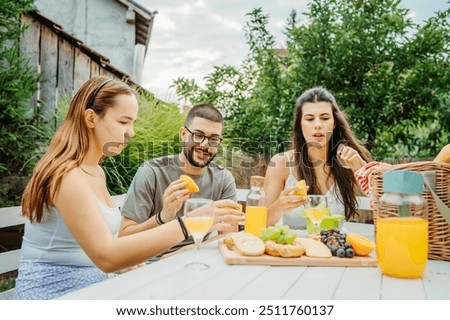 Similar – Infused fruit water cocktails and people talking in background