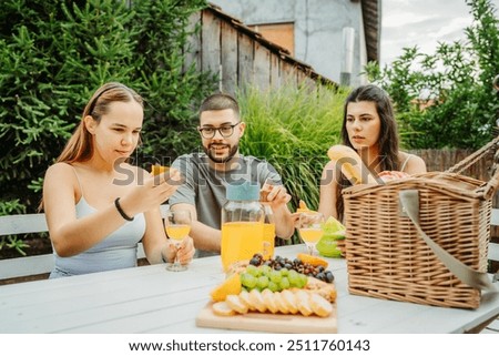 Similar – Infused fruit water cocktails and people talking in background