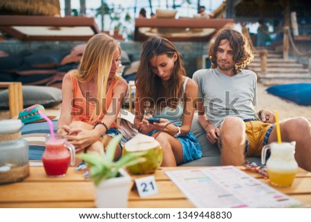 Similar – Infused fruit water cocktails and people talking in background