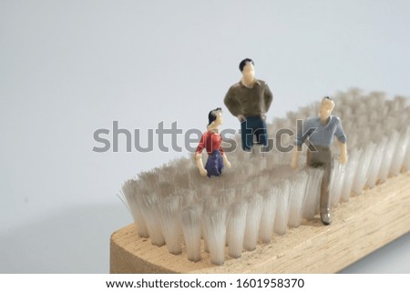 group of tiny miniature worker model people