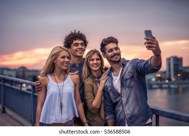 Group Of Tourists Enjoying City Tour And Making A Selfie.