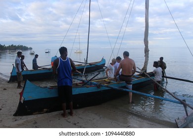Group of tourists and local fishermen preparing for fishing and diving trip on Mozambique Channel on a early spring morning at Ifaty, Madagascar, on March 22th, 2016