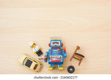 Group Of Toys Isolated On Wood Background. Kids Toy. Plastic And Metal Toy Material. Vintage Toy. Toy Collector. Colourful Objects. Space For Text. 