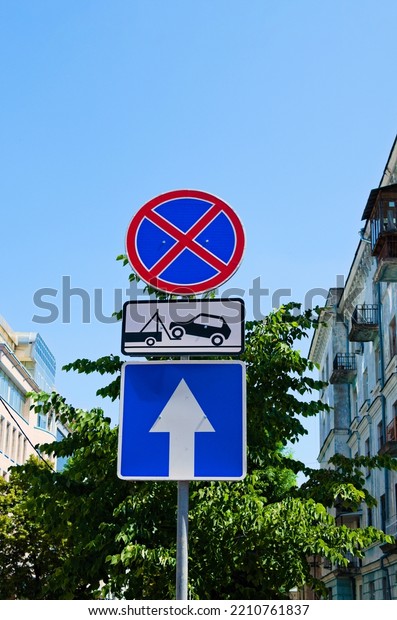 Group of traffic signs on the pole. \
