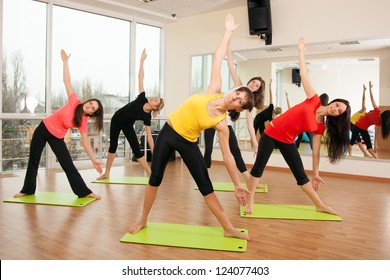 Group training in a gym of a fitness center - Powered by Shutterstock