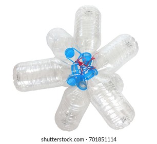 Group of transparent plastic empty bottles with blue cap tied with a red rope on white background