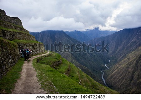 Group of Trekkers admiring the Andes whilst on the way to the Sun Gate on the Inka Trail before heading down to Machu Picchu