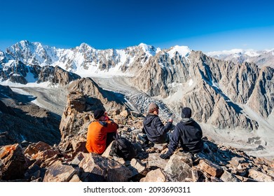 Group of trekkers climbers alpinists conquering Pik Uchitel peak from Racek Hut in Ala Archa Alpine National Park Landscape near Bishkek, Tian Shan Mountain Range, Kyrgyzstan, Central Asia. - Shutterstock ID 2093690311