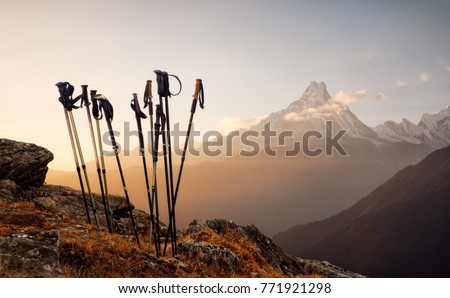 Group of trekking sticks on a mountain top background.Beautiful inspirational landscape, trekking and activity.
