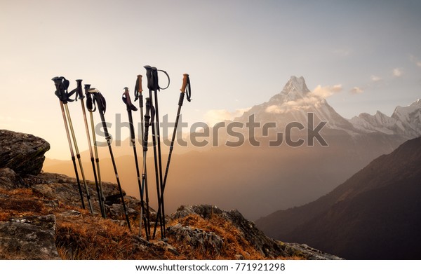 Group of\
trekking sticks on a mountain top background.\
Beautiful\
inspirational landscape, trekking and\
activity.