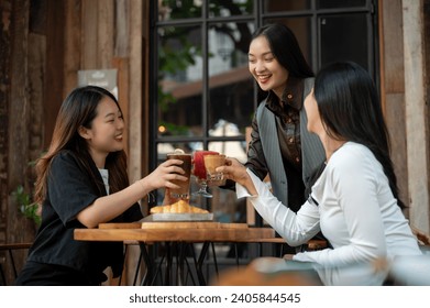 A group of trendy, happy Asian girls are drinking and enjoying talking in a cafe in the city on the weekend together. City life, friendship, lifestyle - Powered by Shutterstock