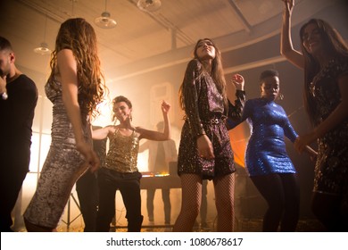 Group Of Trendy Young Women Having Fun Enjoying Nightclub Party, Beautiful Girls Dancing On Dim Smoky Dance Floor