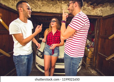 A Group Of Two Boys And One Girl Are Smiling And Having Fun Next To A Parking White Car And Runining Garage