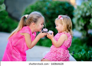 group of two children cute fashion little girls eat happy birthday pink cupcake - Powered by Shutterstock