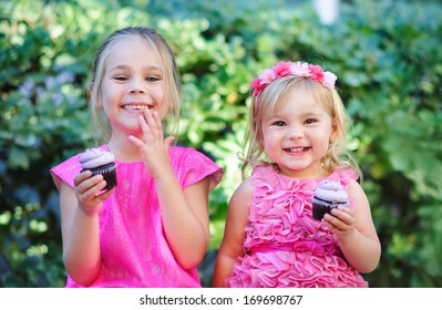 group of two children cute fashion little girls eat happy birthday pink cupcake - Powered by Shutterstock