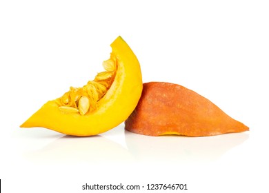 Group of two slices of fresh red kuri pumpkin hokkaido variety with seeds isolated on white background
