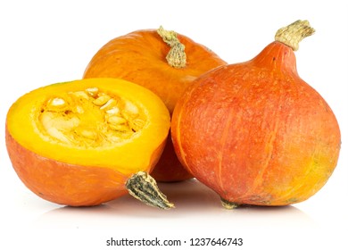 Group of two whole one half of raw fresh red kuri pumpkin hokkaido variety isolated on white background