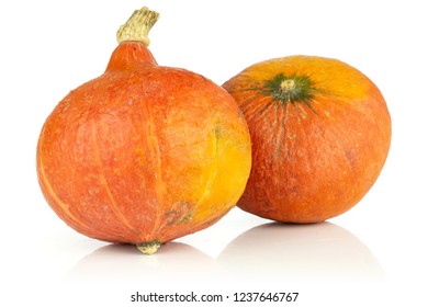 Group of two whole raw fresh red kuri pumpkin hokkaido variety isolated on white background