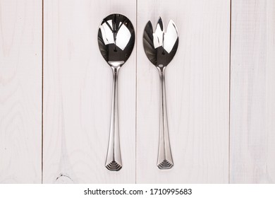 Group Of Two Whole Salad Spoon On White Wood