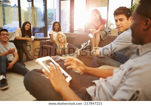 Group Of\
University Students Relaxing In Common\
Room