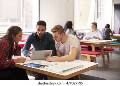 Group Of University Students Working In Study Room