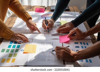 Group of ux developer and ui designer brainstorming about app interface design at modern office. Creative digital development agency