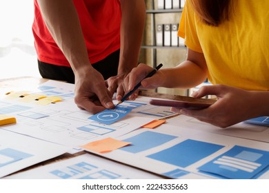 Group of ux developer and ui designer brainstorming about app interface design at modern office. Creative digital development agency