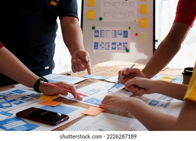 Group of ux developer and ui designer brainstorming about app interface design at modern office. Creative digital development agency