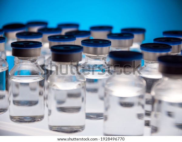 Group of Vaccine bottles. Medicine\
in ampoules. Glass vials for liquid samples in\
laboratory.
