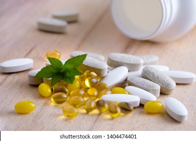 A group of various food additives with a plastic jar on a wood background. As a concept of natural medicines. Preventive medicine. Prevention of coronovirus.