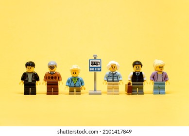 Group of various sad people waiting at bus stop. Illustrative editorial. January 02, 2022 - Shutterstock ID 2101417849