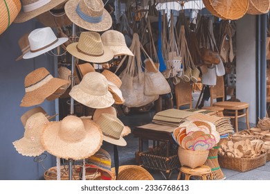 Group of Vintage fashion Hats on tier hanger Display Stand with many various of Products made from natural Materials for Sale in Street Market at Thailand. - Powered by Shutterstock