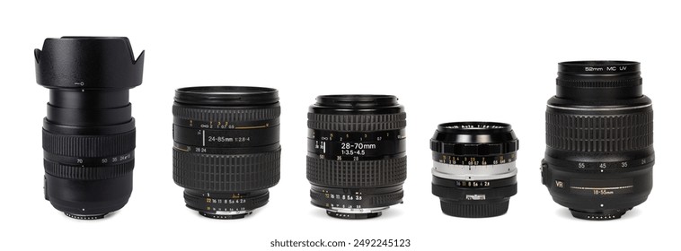 A group of vintage and modern camera lenses, ranging from wide-angle to telephoto, are arranged neatly on a white surface. - Powered by Shutterstock